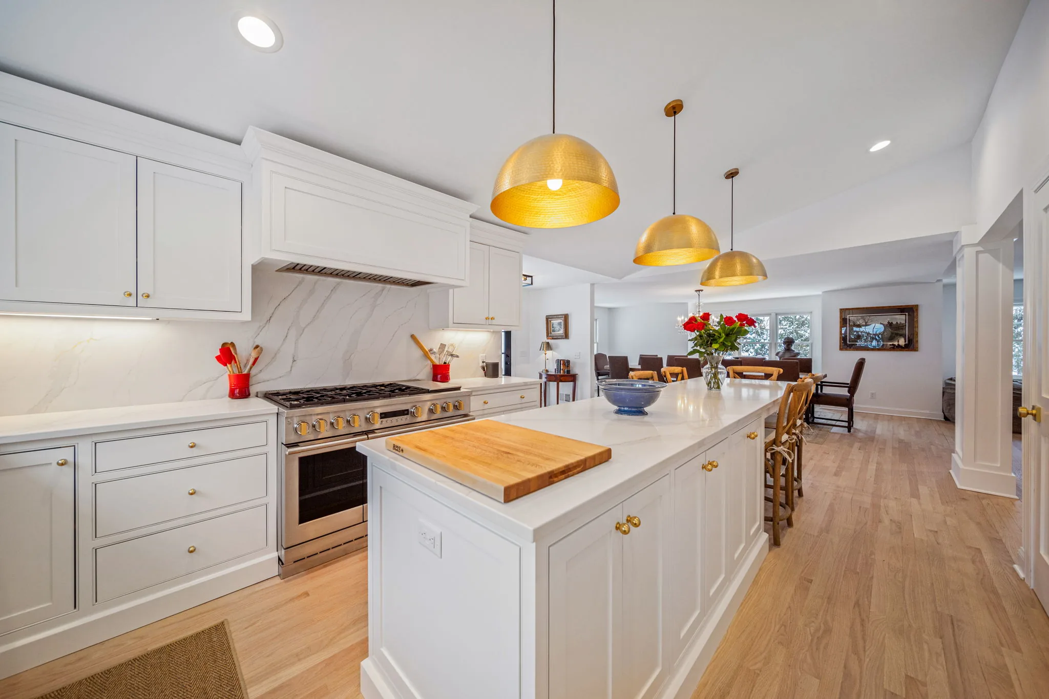 Gourmet kitchen with professional range and marble backsplash — kitchen renovation